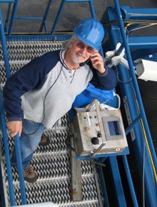 Tom Orvosh at the huge winch, which raises and lowers the Argus sled and the ROV Hercules.