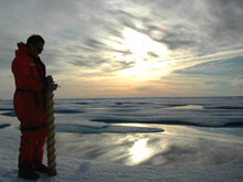 Chief Scientist Rolf Gradinger is silhouetted by the Arctic sun.