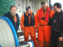 Dale Chayes and Chief Scientist Rolf Gradinger offer a warm welcome to NSBSAR pilots Chuck Bensow and Hugh Patkotak. After flying a needed ROV part from Barrow, Alaska to the USCGC HEALY in the Arctic Ocean, the pilots received lunch, fuel, a tour of the ship, and many rounds of thanks before beginning their return flight to Barrow.