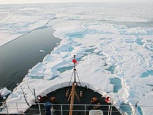 USCGC Healy cuts through young Arctic ice during the first day the cruise is underway.