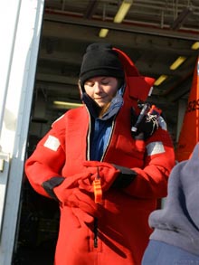 Kelley Elliott, web coordinator for the Hidden Ocean expedition, practices emergency safety procedures.