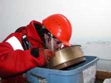 Scientist Brenda Holladay takes a close look at benthic organisms in a sieve.