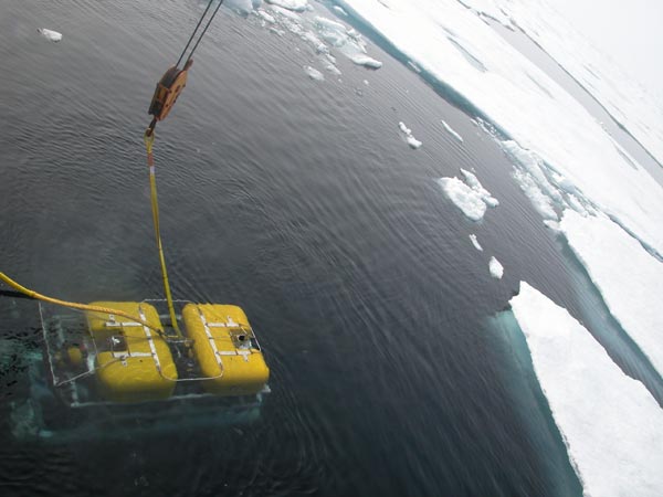 A view of the ROV as it descends under icy Arctic waters.