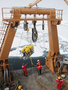 The ROV is deployed off the back of the boat using the Healy's Crane.