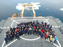 The science team and Healy crewmembers pose for a group picture on the Healy's helo deck.