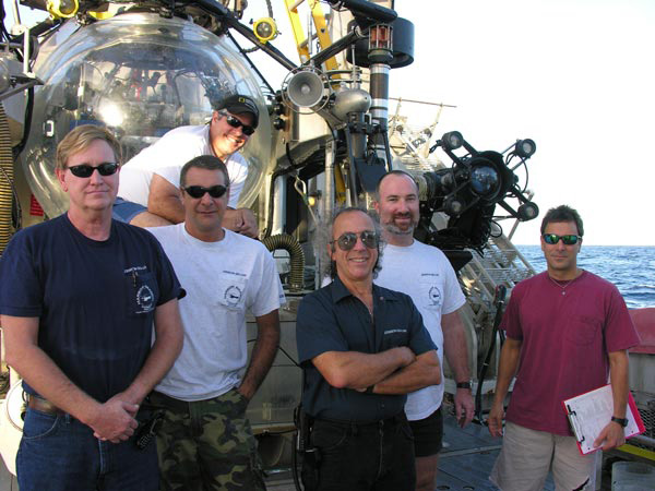 Figure 3: Submersible crew, l. to r.:  Al Fuller, Frank Lombardo, Don Liberatore, Tim Askew, Jr., Phil Santos.  Back:  Hugo Marrero.