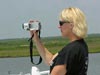 Web Coordinator Cindy Renkas takes photos and videotapes to include in daily logs posted on the NOAA Ocean Exploration Deep Scope Web site.
