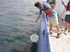Jon Cohen sets up his plankton net for a 15-minute tow alongside the R/V Seward Johnson.