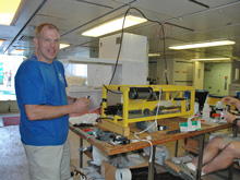 Chemical Oceanographer, Joe Resing, prepares a hydrothermal plume sensor for deployment with the DSL-120 sonar sled.