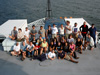 Team members of the GalAPAGoS expedition pose for a group shot on the RV Thompson's 03 deck.