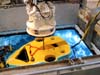 The remotely operated vehicle (ROV) Tiburon is launched though the 'moonpool,' a special opening in the middle of the research vessel (R/V) Western Flyer.