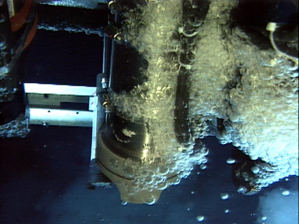 Droplets of liquid carbon dioxide adhere to the underside of the ROPOS ROV arm during sampling.