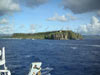 A last glimpse of the island of Guam as the R/V Melville  heads out of the harbor and steams toward Seamount-X.