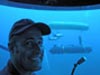 Thetis pilot Kostas Katsaros smiles for a picture inside Thetis' bathysphere.