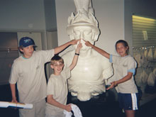 Cameron, David and Marena point to the bust at the Mariner’s Museum