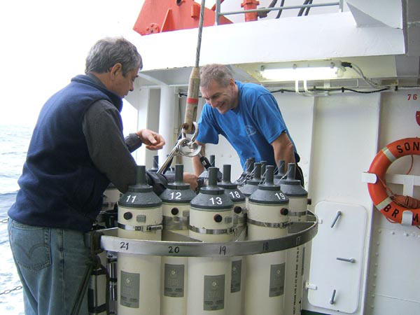 Scientist examine the CTD package before its deployment at Brothers volcano.