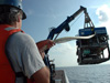 During ROV recovery, Jason engineer Casey Agee grasps the neutrally-buoyant tether that connects Jason and Medea.