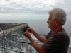 During the transit to AT340, Benthic ecologist Bob Carney puts the finishing touches on a fish trap.