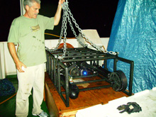 Dr. Cabell Davis readies his Video Plankton Recorder (VPR) for
          its first cast in the Celebes Sea. 