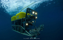 Figure 3.  The ROV, with headlights on and samplers at the ready, begins
its descent. 