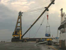 The barge-mounted crane lowers the 6-ton winch for the ROV down to the stern deck of the BRP Hydrographer Presbitero