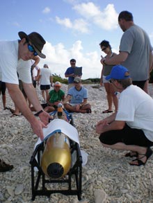 Students gather around as members of the science party prepare to launch the Gavia AUV at Pink Beach.