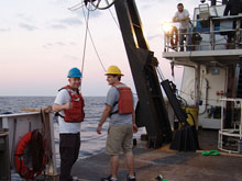 Matt and Jay prepare to help recovery the remotely operated vehicle (under the watchful eye of chief scientist Erik Cordes).