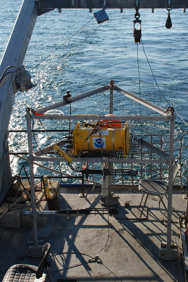 A bottom-resting tripod, equipped with a suite of sensors sits on the deck of the Laurentian awaiting deployment near the Isolated Sinkhole 