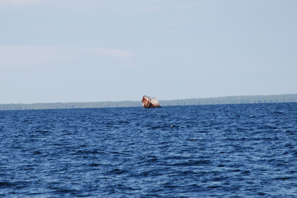 A part of the German freighter, Nordmeer still protrudes from the waters of Lake Huron in the Thunder Bay National Marine Sanctuary.