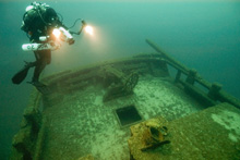 Thunder Bay Marine Sanctuary Diver, Russ Green, explores the wreck of the 19th century schooner Barney.