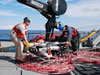 Andrew Yagiela and Jody Breen maneuver the Phantom ROV on the deck of the Laurentian preparing for operations.