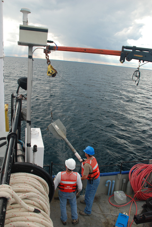 The crew of the R/V LAURENTIAN prepare to deploy a gravity core down 93 meters