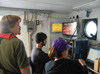 Experiencing data collection first hand, scientist watch the piloting of the Phantom ROV.