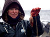 Sarah Minks Hardy holds an octocoral as tall as she is.