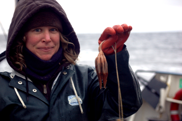 Sarah Minks Hardy holds an octocoral as tall as she is, found in a trawl on September 22. The live, intact specimen helped other scientists aboard identify the pieces of octocoral skeletons they had found in deeper waters in the preceding days.