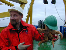 Russ Hopcroft of University of Alaska, Fairbanks displays one of the larger and more festive starfish brought up in a benthic trawl.
