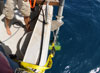 Multibeam sonar transducers deployed at the end of a pole secured alongside the boat.
