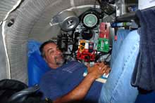 Johnson Sea Link pilot, Frank Lombardo, shown in the aft chamber of the Johnson Sea Link submersible.