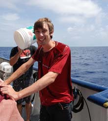 Marine Biologist undergraduate student gets doused with sea water by Dr. Steve 
Haddock after his first submersible dive experience..