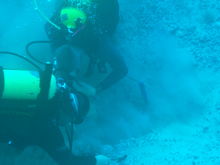 Drs. Hemming and Alvarado dig a hole through old coral covering the buried ancient Suwannee River, about 75 miles offshore.