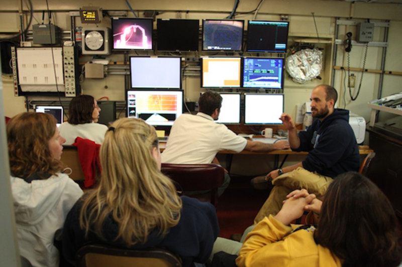 Figure 1. Scientists in the main lab get ready to watch live video of the seafloor which is being recorded by the camera system mounted on the multi-core instrument.