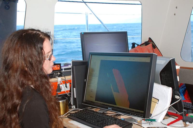 OSU graduate student Bran Black works with sonar bathymetry data to create a map of the sea floor in the area where the San Andreas Fault goes off shore.