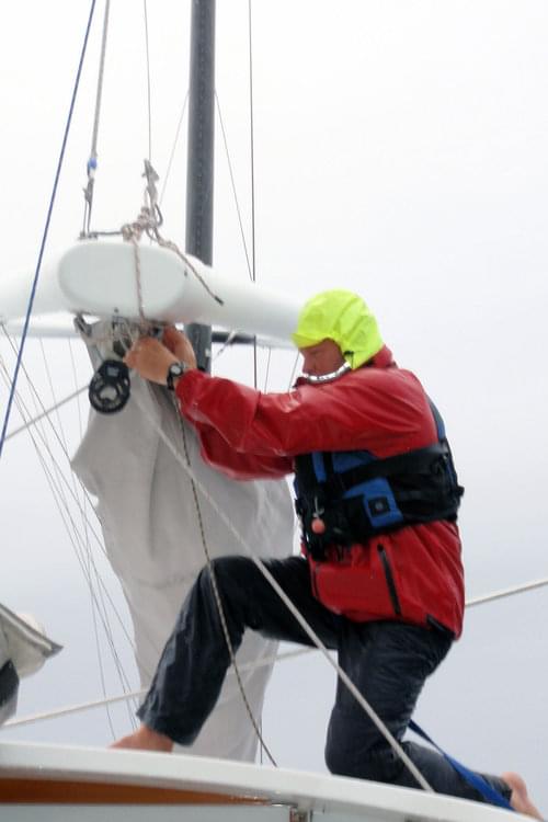 <em>Baylis</em> Captain Mark Kocina handles the wheel while First Mate Sam Kesten watches.