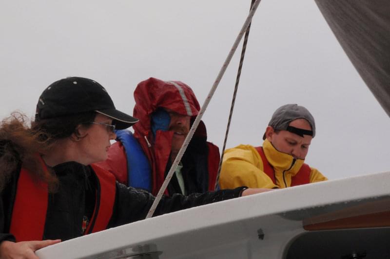 Bran Black, Chris Goldfinger and Morgan Erhardt begin work on the broken support strut.