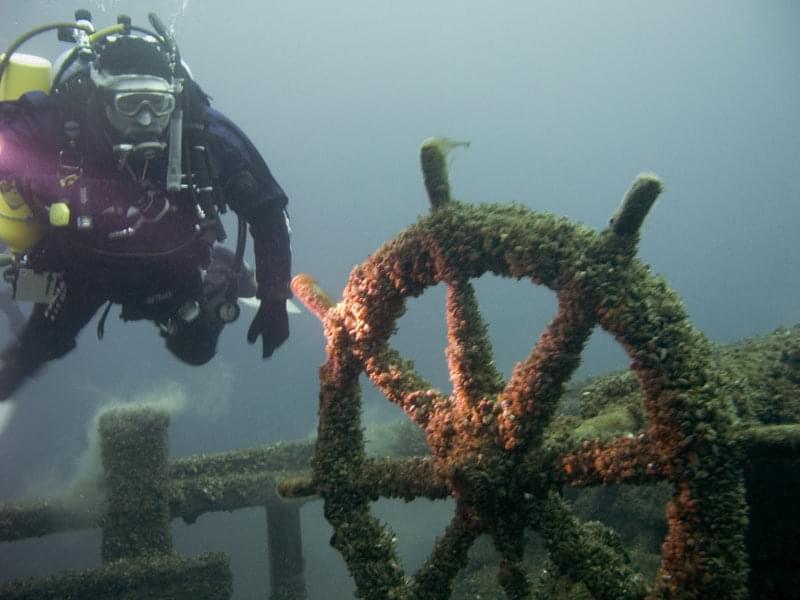 Maritime archeologists use scuba to explore the F.T. Barney wreck.