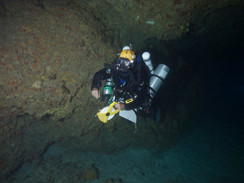 Brian Kakuk making his way back to the boat after measuring the cave and collecting compass headings