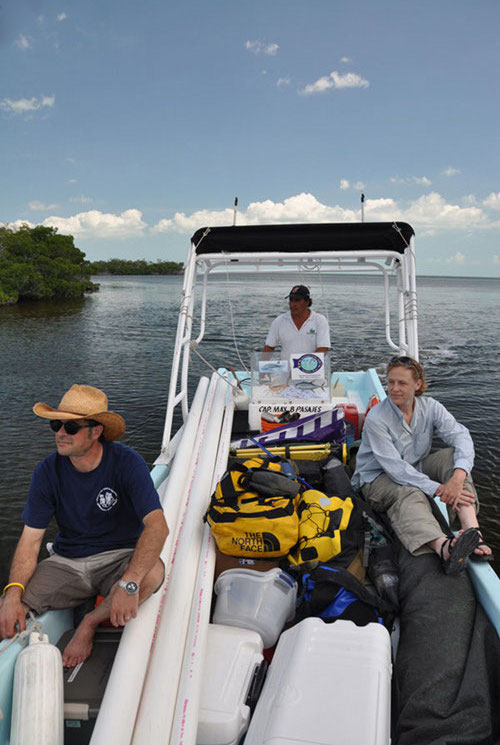 Surrounded by equipment and supplies for several days of field work, Dominique Rissolo and Beverly Goodman arrive at Vista Alegre on one of the local lanchas from Chiquila, captained by Roberto Echevaria. 