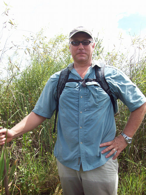 Palm Beach Palm Beach Maritime Academy Teacher, Steven Allen is shown here slogging in the Everglades.