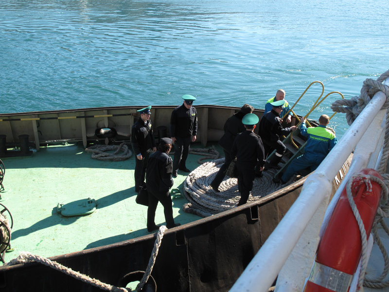 Customs and immigration officials inspect the the Russian research vessel Professor  Khromov.