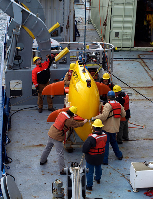 After some careful handling and operations – especially on an increasingly lively ship as the weather picks up – Sentry is safely lowered back into its cradle.  Almost immediately, downloading of the data from the just-completed mission and servicing of the vehicle to prepare it and get it ready for the next dive will begin.